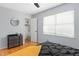 Bright bedroom featuring hardwood floors, closet, dresser, and large window at 1002 Willow Dr # Apt 107, Chapel Hill, NC 27514