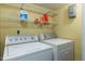 The laundry room features a washer, a dryer, and wire shelving at 1002 Willow Dr # Apt 107, Chapel Hill, NC 27514