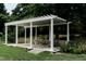 A covered patio with an outdoor table and chairs at 1002 Willow Dr # Apt 107, Chapel Hill, NC 27514