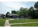 A fenced pool with lounge chairs is visible on the grass at 1002 Willow Dr # Apt 107, Chapel Hill, NC 27514
