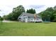 Charming home with a spacious backyard, featuring a deck and fenced in yard at 1008 Catsby Cir, Raleigh, NC 27603