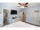 Bedroom with bathroom and closet entrances, as well as white washed drawers and wood look floors at 1008 Catsby Cir, Raleigh, NC 27603
