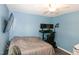 Bedroom featuring multiple monitors, desk and a ceiling fan at 1008 Catsby Cir, Raleigh, NC 27603