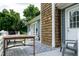 Outdoor deck area, perfect for entertaining or relaxing, with grill, table, and seating at 1008 Catsby Cir, Raleigh, NC 27603