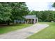 Charming home with a well-manicured front lawn and extended driveway at 1008 Catsby Cir, Raleigh, NC 27603
