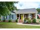 Beautiful home with blue siding, a welcoming yellow front door, and a lovely front yard at 1008 Catsby Cir, Raleigh, NC 27603