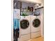Convenient laundry area with a side by side washer and dryer inside a closet at 1008 Catsby Cir, Raleigh, NC 27603