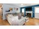 Comfortable living room boasts a fireplace and large sectional sofa, perfect for relaxing and entertaining at 1008 Catsby Cir, Raleigh, NC 27603