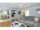 Open-concept living room with hardwood floors offers views into the dining room and kitchen, promoting social interaction at 1008 Catsby Cir, Raleigh, NC 27603