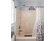 Clean shower and tub combination with shower curtain and window with blinds at 1008 Catsby Cir, Raleigh, NC 27603