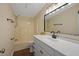 Well-lit bathroom featuring a white vanity, modern fixtures, and a tub-shower combination at 101 Hunter Fld, Sanford, NC 27332