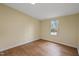 Bright bedroom with wood-look floors and a window offering a pleasant view at 101 Hunter Fld, Sanford, NC 27332