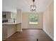 Cozy dining room featuring new hardwood floors and a modern lighting fixture at 101 Hunter Fld, Sanford, NC 27332