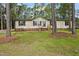 Charming home with a manicured lawn and surrounded by mature trees at 101 Hunter Fld, Sanford, NC 27332