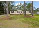Inviting home with lush green lawn and a backdrop of towering trees at 101 Hunter Fld, Sanford, NC 27332