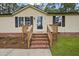Inviting front porch with brick steps leading to the entrance at 101 Hunter Fld, Sanford, NC 27332