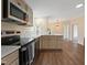 Well-lit kitchen featuring stainless steel appliances and modern countertops at 101 Hunter Fld, Sanford, NC 27332