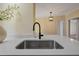Close up of kitchen sink with quartz countertops and a modern faucet at 101 Hunter Fld, Sanford, NC 27332