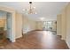 Open-concept living room featuring modern light fixtures and fireplace at 101 Hunter Fld, Sanford, NC 27332