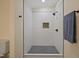 Walk-in shower with white wavy tile and black fixtures at 101 Hunter Fld, Sanford, NC 27332