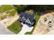 Aerial view of new construction home with a large front yard and three-car garage at 1012 Lily Claire Ln, Fuquay Varina, NC 27526