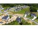 An aerial view of a new neighborhood with modern homes, featuring ample green spaces and community development at 1012 Lily Claire Ln, Fuquay Varina, NC 27526