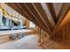 Unfinished attic has wooden beams and floor, and contains the HVAC equipment at 1012 Lily Claire Ln, Fuquay Varina, NC 27526