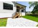 Backyard shows the stairs leading to the covered patio, with a modern white exterior at 1012 Lily Claire Ln, Fuquay Varina, NC 27526