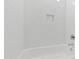 Bright bathroom showcasing white subway tile surrounding a bathtub with chrome fixtures at 1012 Lily Claire Ln, Fuquay Varina, NC 27526