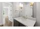 Bathroom featuring a vanity with a stone countertop and modern fixtures at 1012 Lily Claire Ln, Fuquay Varina, NC 27526