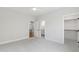 Bright bedroom with plush carpet and access to both a bathroom and walk-in closet at 1012 Lily Claire Ln, Fuquay Varina, NC 27526