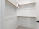 Walk-in closet with carpet, white walls, and wood shelving at 1012 Lily Claire Ln, Fuquay Varina, NC 27526