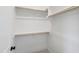 Walk-in closet with custom shelving, hanging rods, and neutral carpet at 1012 Lily Claire Ln, Fuquay Varina, NC 27526