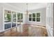 Dining room featuring a stylish light fixture and scenic views of the surrounding landscape at 1012 Lily Claire Ln, Fuquay Varina, NC 27526