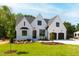 Charming new build featuring a manicured lawn, a two car garage, and classic brickwork with a modern design at 1012 Lily Claire Ln, Fuquay Varina, NC 27526