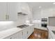 Kitchen features stainless gas range, modern white cabinets, and white subway tile backsplash at 1012 Lily Claire Ln, Fuquay Varina, NC 27526