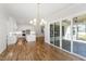 Open-concept kitchen features a center island, modern appliances, and seamless access to an outdoor patio at 1012 Lily Claire Ln, Fuquay Varina, NC 27526