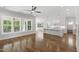 Bright living area seamlessly connects to the kitchen, featuring ample natural light at 1012 Lily Claire Ln, Fuquay Varina, NC 27526