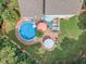 Aerial view of the backyard with a pool, patio, and deck, perfect for outdoor entertaining at 102 Lake Meadow Dr, Apex, NC 27502