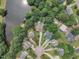 Picturesque aerial view of a residential area with a pond and cul-de-sac at 102 Lake Meadow Dr, Apex, NC 27502