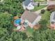 Aerial view of a home, pool, manicured yard, and neighboring properties at 102 Lake Meadow Dr, Apex, NC 27502