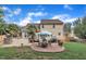 Backyard with a patio, furniture, outdoor grill, and landscaped lawn at 102 Lake Meadow Dr, Apex, NC 27502