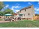 Backyard with a patio, furniture, outdoor grill, and landscaped lawn at 102 Lake Meadow Dr, Apex, NC 27502