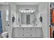 Bright bathroom with double sinks, a large mirror, and ample storage at 102 Lake Meadow Dr, Apex, NC 27502