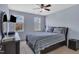 A serene bedroom with a ceiling fan, windows, and contemporary decor at 102 Lake Meadow Dr, Apex, NC 27502