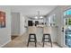 Kitchen with breakfast bar, white cabinets, and stainless-steel appliances at 102 Lake Meadow Dr, Apex, NC 27502