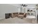 Spacious living room featuring a large sectional couch and open access to the kitchen at 102 Lake Meadow Dr, Apex, NC 27502