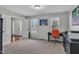 Spacious office area with neutral walls, carpet flooring, and a functional black desk with natural light at 102 Lake Meadow Dr, Apex, NC 27502