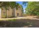 Rear exterior view of a two-story home with a patio and lawn at 103 Burham Ct, Apex, NC 27502