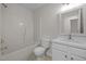 Bathroom with tub/shower, tile floors and single sink vanity at 103 Burham Ct, Apex, NC 27502